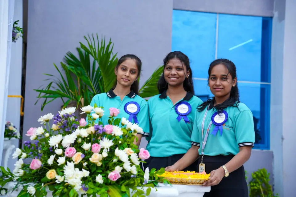 Students welcoming guests with flowers