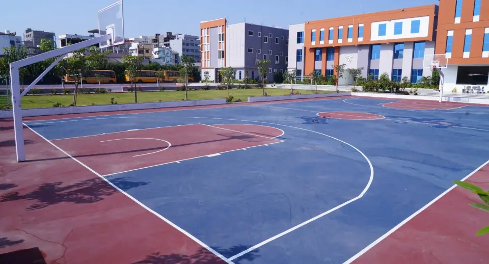 The court with campus buildings behind