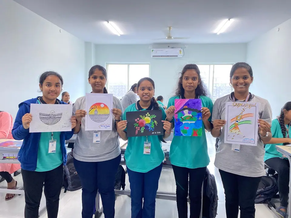 Students showing their artwork