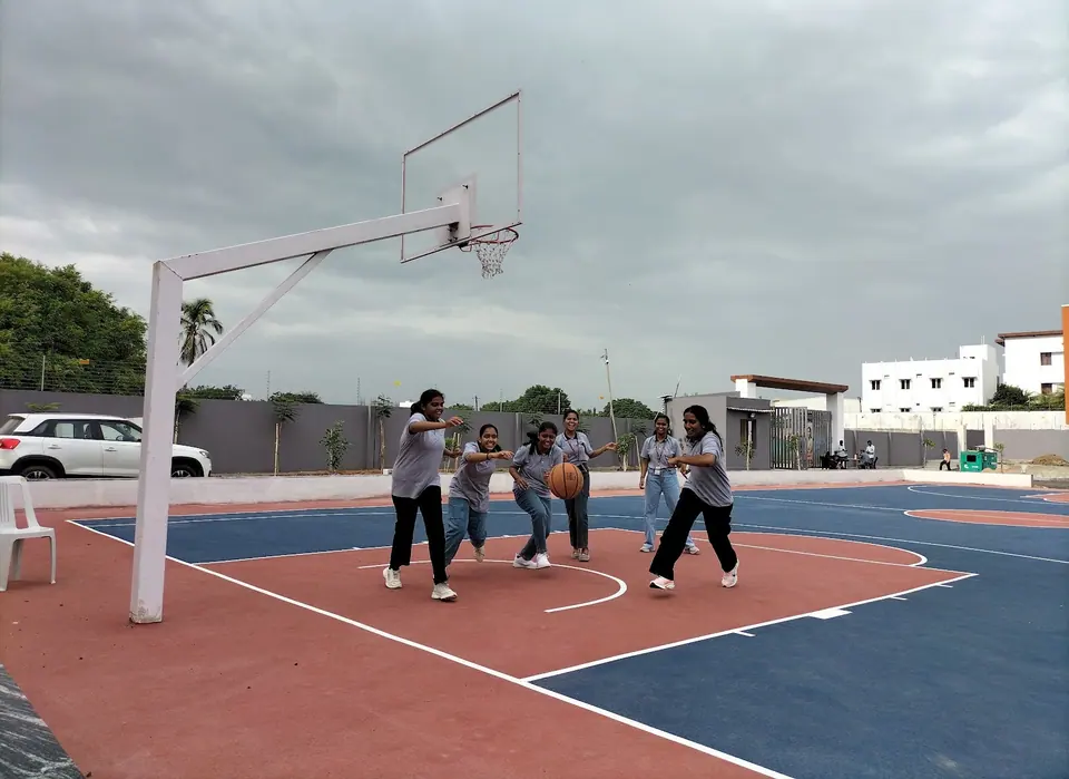 A basketball game on the outdoor court