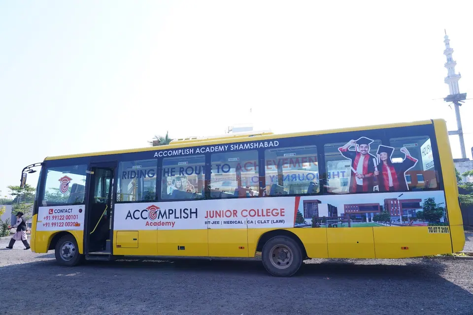 An Accomplish Academy bus parked on campus