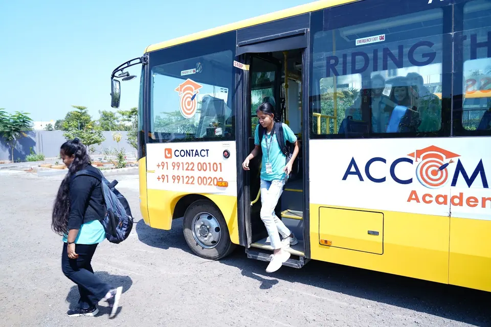 A student stepping off the Accomplish bus