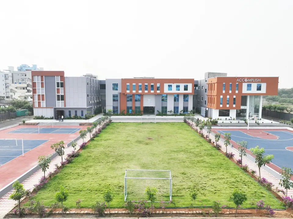 An aerial view of the campus, sports courts and green ground