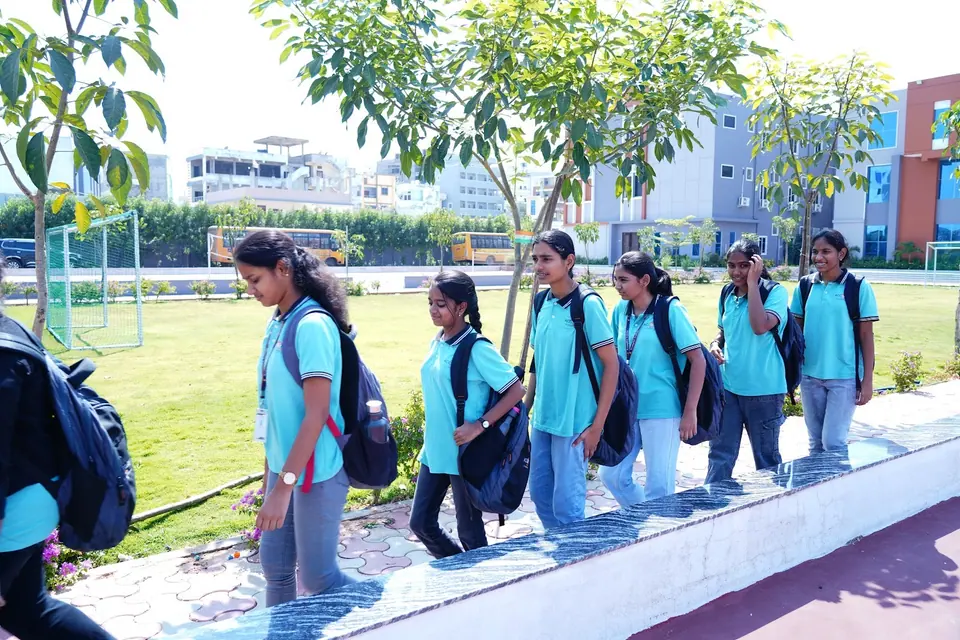 Students walking along the garden path to class