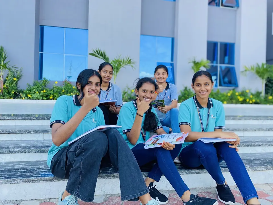 Students sitting together on the campus steps
