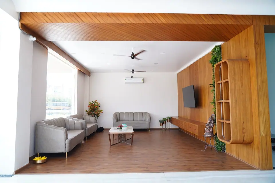 The visitors’ lounge with sofas and wooden panelling