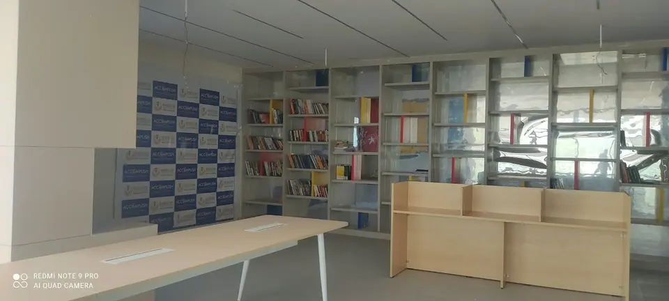 The library with tall bookshelves and reading tables