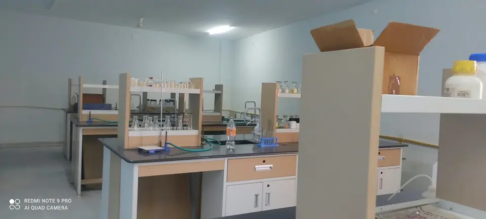 A chemistry workbench with bottles and equipment